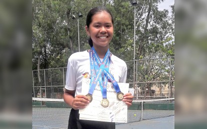 <p><strong>TOP NETTER:</strong> Althea Rose Martirez wearing the three gold medals she won  in the Philippine Youth Games - Batang Pinoy (PYG-BP) Visayas qualifying leg in Iloilo City on Saturday (March 2, 2019). <em>(Photo courtesy of Judith Caringal of Radyo Pilipinas 2) </em></p>