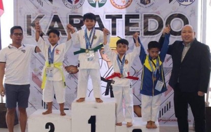 <p>Bacolod City’s Chris Cholo Nicoli Salcedo (center) wins gold in the 8-9 years old boys category of intermediate kata during the Batang Pinoy 2019 Visayas Qualifying Leg held in Iloilo City. <em>(Contributed photo)</em></p>
<p> </p>
<p> </p>