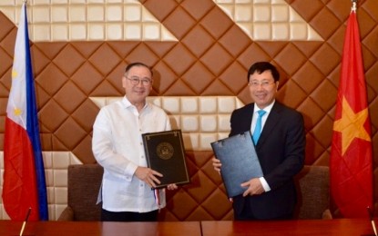 <p style="text-align: left;">Foreign Affairs Secretary Teodoro L. Locsin Jr. and Vietnamese Deputy Prime Minister and Foreign Minister Pham Binh Minh sign the Philippines-Viet Nam Five-Year Plan of Action 2019-2024 following the 9th Meeting of the Philippines-Viet Nam Joint Commission for Bilateral Cooperation (JCBC) in Manila. <em>(Photo courtesy of DFA/ Clark Galang)</em></p>