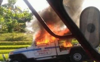 <p><strong>TORCHED.  </strong>A burning police squad car seen after the New People's Army rebels set it on fire during an attack Monday morning (March 11, 2019)  in Motiong, Samar. The attack killed a policeman and injured another police personnel. <em>(Contributed photo)</em></p>