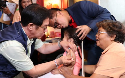 <p>Department of Health (DOH) 4-A Regional Director Eduardo Janairo administers measles vaccine in one of his provincial visits in the ongoing measles mass immunization campaign. <em>(Photo courtesy of DOH 4-A)</em></p>