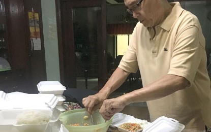 <p>August Romero, a retired engineer, and his wife Imelda, voluntarily feed the poor near their residence in Quezon City three times a week, with home cooked, good food.  They have been  doing this for last five years. <em>(Photo by Santosh Digal)</em></p>
