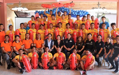 <p>The 32 graduates of DOH-4A's Lifeguard Qualification Training Course in partnership with the Philippine Coast Guard (PCG) District- NCR and Department of Tourism (DOT) together with regional directors Eduardo Janairo (with vest) and Marites Castro (DOT, center), Paolo Abejuela, Sheila Blancaver in San Juan, Batangas on Mar. 13, 2019. <em>(Photo courtesy of DOH-4A)   </em></p>