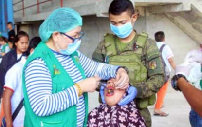 <p><strong>HEALTH MISSION.</strong> A dentist from Maguindanao and a soldier perform tooth extraction to one of the indigent patients during medical-dental outreach program in Ampatuan, Maguindanao. <em><strong>(Photo courtesy of 6ID)</strong></em></p>