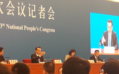 <p>Chinese Premier Li Keqiang answers questions of the media in a press conference during the closing ceremony of the Two Sessions on March 15 at the Great Hall of the People in Beijing.<em> (PNA Photo by Kris Crismundo)</em></p>