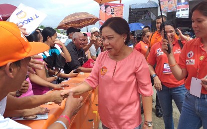 <p>Senator Cynthia Villar greets supporters outside the Tacloban City Astrodome on Tuesday (March 19, 2019).<em> (Photo by Sarwell Meniano)</em></p>