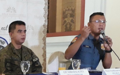 <p>Lt Col. Ezara Balagtey, spokesperson of the Eastern Mindanao Command, and Police Major Jason Baria, allay fears on the Comelec's declaration of Mindanao as election hotspot under Category Red during the AFP-PNP press briefing on Wednesday in Davao Cityl. <em><strong>(PNA photo by Lilian Mellejor)</strong></em></p>