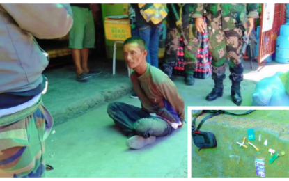 <p><strong>SECOND TIME.</strong> Police agents handcuff former illegal drug peddling convict Norodin Mamaluba following his arrest Thursday (March 21) in Cotabato City for allegedly selling shabu to poseur-buyer. (<em><strong>Photo courtesy of Jome Dimapalao –Brigada News Cotabato)</strong></em></p>