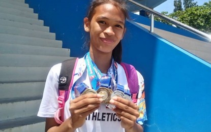 <p><strong>MULTI-MEDALIST.</strong> Evita Ruth Belloso of Laguna Province shows the five medals she won at the Philippine Youth Games-Batang Pinoy (PYG-BP) Luzon qualifying leg in Ilagan City, Isabela on Saturday (March 23, 2019). <em>(Photo by Jean Malanum)</em></p>
