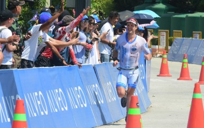 <p>German triathlete Marcus Rolli, who took an early lead on Sunday's Alveo Ironman in Davao City, holds on to win in the long-distance triathlon races in three hours and 49 minutes. </p>