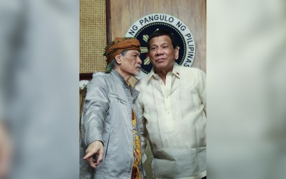<p>President Rodrigo Roa Duterte chats with  Moro National Liberation Front Founding Chairman Nur Misuari at a meeting at the Malacañang on March 19, 2019.<em> (Ace Morandante/ Presidential photo) </em></p>