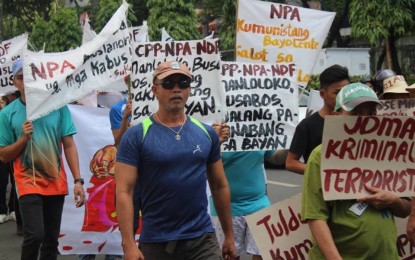 <p><strong>ANTI-COMMUNIST RALLY.</strong> Members of the Sugbo Kontra Komunista (SUKO) march in the downtown streets of Cebu City to condemn the 50 years of atrocities of the Communist Party of the Philippines-New People's Army (CPP-NPA). The NPA, listed as a terrorist organization by the United States and European Union, is celebrating its 50th anniversary Friday (March 29, 2019). <em>(Photo courtesy of Philippine Information Agency-7)</em></p>