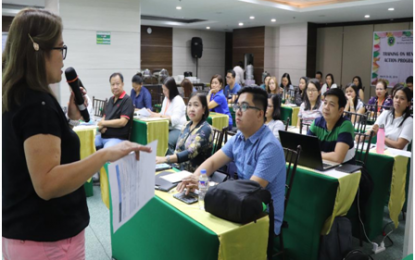 <p>Department of Health (DOH) Calabarzon Mental Health Coordinator Paulina A. Calo (left) underscores the importance of the Mental Health Global Action Plan (mhGAP) Training in identifying early symptoms of persons afflicted with mental illness during the four-day training in Quezon City from March 26-29, 2019. <em>(Photo courtesy of DOH4A-MRCU)</em></p>
