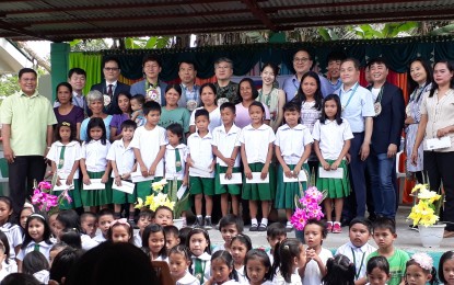 <p><strong>REVISITING THE SCHOOLS.</strong> The delegation from South Korea pose with children and teachers during a visit in Kiling Elementary School in Tanauan, Leyte on Friday (March 29, 2019). Col. Lee Chul Won,  top official of the South Korean Army, visited 13 of the 37 schools Korean soldiers fixed in the towns of Dagami, Tolosa, Tanauan, Palo, and Tacloban City after 'Yolanda'.<em> (Photo by Roel Amazona) </em></p>