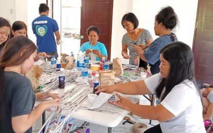 <p>Some women in Basista town are trained to make handicraft products out of recycled solid waste materials. <em>(Photo courtesy of Gellie Saldivar's Facebook account) </em></p>