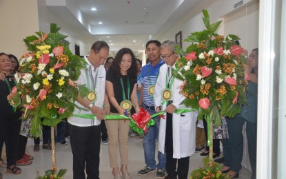 <p><strong>NEW BUILDING.</strong> Gov. Arthur Defensor, Sr. with Mary Jean Palmares-Henson, heir of Don Valerio Palmares, Sr., and Dr. Robert Gerard Yusay cut the ceremonial ribbon during the inauguration of the new two-storey building that will temporarily hold patients as the new PHP31 million hospital building awaits completion on Wednesday (April 3, 2019). Defensor urged hospital chiefs in district hospitals to always serve the poor.<em> (Photo courtesy of Capitol PIO)</em></p>
<p> </p>