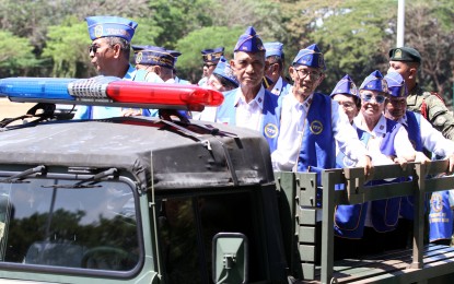 <p>War veterans riding a military truck during the trooping the line ceremony at the Philippine Army Headquarters in observance of the Philippine Veterans Week. (PNA photo by Oliver Marquez)</p>