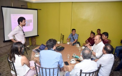 <p><strong>FEASIBILITY STUDY. </strong>Sarangani Governor Steve Chiongbian Solon (seated, far right), chair of the Malungon-Buayan River Basin Management Council, discusses the USD31 million (PHP1.6 billion) watershed ecosystem rehabilitation project with foreign consultants and members of the feasibility study team at the Provincial Capitol on March 29, 2019. The river basin is being threatened by the denudation of forest and degradation of its ecosystem, as well as the high rate of erosion and siltation. <em>(Photo courtesy of the Sarangani Governor's Office)</em></p>