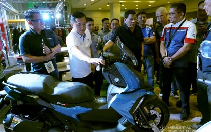 <p>President Rodrigo Duterte views one of the big bike models on display at the Iloilo Convention Center (ICC)  in Mandurriao, Iloilo, as part of the 25<sup>th</sup> National Federation of the Motorcycle Clubs in the Philippines (NFMCPs) national convention April 5-6, 2019. He is joined by former Special Assistant to the President (SAP) Christopher Lawrence “Bong” Go. <em>(PCOO photo)</em></p>
<p> </p>