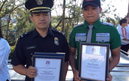<p>City Fire Marshall Chief Insp. Nestor Gorio and criminology student Brent Bernard of Easter College were awarded by the Civil Service Commission for efficient public service during a surprise check of CSC Commissioner Aileen Lizada in March. They were awarded during the flag-raising ceremony on Monday (April 8, 2019). <em>(Photo courtesy of Bong Cayabyab/PIO-City Hall)</em></p>