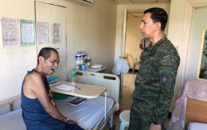 <p>Brig. Gen. Benedict Arevalo, commander of the 303rd Infantry Brigade in Negros Island, visits captured top New People’s Army leader Francisco “Frank” Fernandez at the Philippine Army General Hospital  in Fort Bonifacio, Taguig City on April 5. <em>(Photo courtesy of 303rd Infantry Brigade, Philippine Army)</em></p>