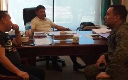 <p>Philippine Army 78<sup>th</sup> Infantry Battalion commander Lt. Col. Roberto Obaob (right) meets with Southern Leyte Governor Damian Mercado (center) and Vice Governor Christopher Yap to discuss efforts to prevent entry of the New People's Army in the province. On March 15, 2019, the provincial government issued a resolution denouncing the presence of NPA in their province. <em>(Philippine Army photo)</em></p>
