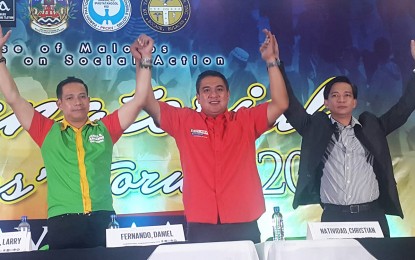 <p><strong>GUBERNATORIAL CANDIDATES' FORUM.</strong> (From left to right) Vice Governor Daniel R. Fernando of the National Unity Party, Malolos City Mayor Christian 'Agila' Natividad of the Democratic Party of Filipino-Lakas ng Bayan (PDP-Laban), and economist Jayson Ocampo, bare their plans for the province of Bulacan if they are elected in the May 13 election.  The three attended the Gubernatorial Candidates' Forum organized by the Diocese of Malolos in St. Luke's Martin of Tours, in Bocaue, Bulacan on Monday (April 8, 2019). <em>(Photo by Manny Balbin)</em></p>