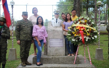 <p><strong>UNSUNG HERO.</strong> The children and grandchildren of  Colonel Osito Bahian in Malaybalay, Bukidnon, pose with the monument of the late soldier during the "Araw ng Kagitingan" commemoration. Col. Bahian served as commanding officer of Army's 1107th Community Home Defence Center. <strong><em>(4ID Photo)</em></strong></p>