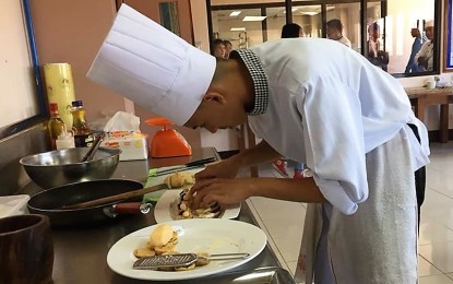 <p>Tech-voc students join the cookery category during the regional skills competition that opened on April 9 until April 12. There are 28 students vying for slots in the different trade skills and who may compete in world skills competition in 2020.<em> (Photo courtesy of Carlito Dar/ PIA-CAR)</em></p>