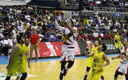 <p>San Miguel center Junemar Fajardo scores an uncontested layup to finish with 32 points that helped the Beermen beat TNT KaTropa, 96-86, at the Araneta Coliseum on Wednesday (April 10, 2019). The win sent SMB to semifinals against Phoenix. <em>(PNA photo by Jess M. Escaros Jr.)  </em></p>