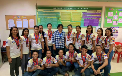 <p><strong>CHAMPIONS.</strong> Tacurong City arnis players pose with Mayor Lina Montilla om Friday (April 12, 2019) after they presented her the medals they won in recent international 'arnis' tournament held in Cebu City. The team brought home 15 gold medals.  <em>(Photo courtesy of Tacurong CIO)</em></p>