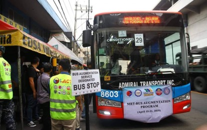 <p><strong>BUS AUGMENTATION.</strong> A public utility bus picks up passengers in various locations along the MRT-3 line starting Monday. MRT operations are suspended from April 15-21 for maintenance works. <em>(Photo courtesy of DOTr) </em></p>