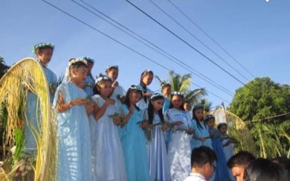 <p><strong>YOUTH'S INVOLVEMENT.</strong> Young girls dressed as angels sing 'Hossana' to re-enact the triumph of Jesus' entry to Jerusalem on Palm Sunday. The Iloilo Provincial Tourism Office  assured the continued observance of Lenten traditions as younger generations are involved in religious activities in the Holy Week. <em>(Photo courtesy of Rose Falle)</em></p>