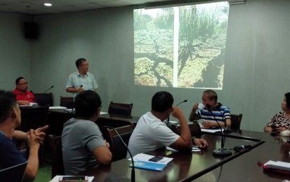 <p><strong>CRACKED FARMLANDS.</strong> Jerry Bionat (standing), Iloilo Provincial Disaster Risk Reduction and Management Office (PDRRMO) chief, presents to the PDRRM Council the cracks at the farmlands of Maasin town caused by the extreme heat. The PDRRMC on Wednesday (April 17, 2019) approved a resolution recommending the declaration of Iloilo province to be placed under a state of calamity due to El Niño.<em> (Photo by Gail Momblan)</em></p>
<p><em> </em></p>