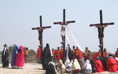 <p>MALELDO 2019. Three men, including penitent Ruben Enaje role playing as Jesus Christ, were nailed to a wooden cross in San Pedro Cutud, San Fernando City, Pampanga on Good Friday (April 19, 2019). Maleldo is a Kapampangan term on the re-nactment of the Passion of Christ. The re-enactment of Christ’s crucifixion is practiced every year in the province and originated in 1955 with the staging of “Via Crucis” (Way of the Cross). (PNA photo by Joey Razon)</p>