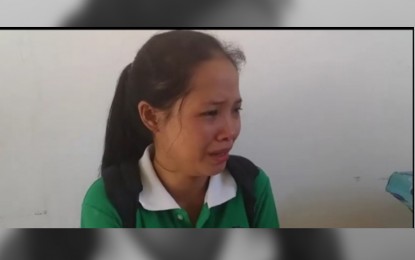 <p><strong>GRIEVING.</strong> Girlie Jane Raymunde weeps after seeing the dead body of his 10-year-old brother  killed when the New People's Army detonated a landmine in San Miguel village, Las Navas, Northern Samar on April 17. She labelled the NPA's latest atrocity as heartless, cruel, and inhuman.<em> (Video grab from Philippine Army 20th Infantry Batallion)</em></p>
<p><em> </em></p>