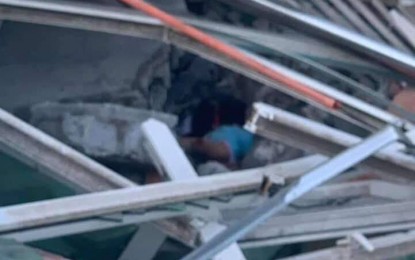 <p><strong>QUAKE FATALITY.</strong> Authorities find a still unidentified fatality buried beneath rubbles in the collapsed Chuzon Supermarket in Porac, Pampanga as a result of a strong earthquake on Monday (April 22, 2019). The Philippine Institute of Volcanology and Seismology traced the epicenter of the tremor in Castillejos, Zambales. <em>(Photo by Marna del Rosario)</em></p>