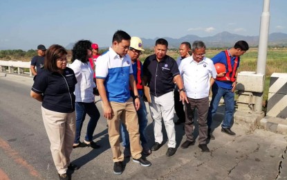 <p><strong>INSPECTION OF QUAKE-DAMAGED BRIDGE.</strong> <br />Public Works and Highways Secretary Mark Villar (in blue and white shirt), together with other DPWH officials, inspect the Consuelo Bridge in Floridablanca, Pampanga on Tuesday (April 23, 2019) after it sustained damage due to the magnitude 6.1 earthquake that struck parts of Luzon. Villar ordered the assessment and repair of all damaged structures in the province to ensure public safety. <em>(Photo courtesy of DPWH Regional Office 3)</em></p>
