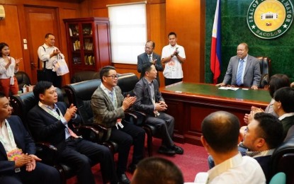 <p><strong>COURTESY CALL.</strong> Bacolod City Administrator John Orola (standing) welcomes the officials of Zhejiang International Contractors Association of China and Multi-Contractors Cooperative of Japan during their courtesy call at the Bacolod City Government Center on Monday (April 22, 2019). They tackled their investment plans and labor-sourcing initiatives in the province.<em> (Photo courtesy of Bacolod City PIO)</em></p>
<p><em> </em></p>