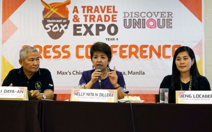 <p><strong>TREASURES OF SOX.</strong> Department of Tourism Region 12 Dir. Nelly Dillera says tourist arrivals in Soccsksargen continues to increase since 2014, during the Treasures of SOX travel and trade expo at Max's Restaurant in Ermita, Manila on Thursday (April 25, 2019). <em>(PNA photo by Ben Briones)</em></p>