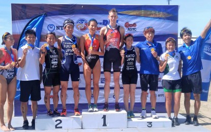 <p><strong>TRIATHLON WINNERS.</strong> Top finishers Oscar Coggins of Hong Kong and Mengying Zhong of China with other medalists during the medal ceremony of the 2019 NTT ASTC Subic Bay International Triathlon (SuBIT) Asian Cup on Sunday (April 28, 2019). <em>(Photo courtesy of John Mogol/Radyo Pilipinas2)</em></p>