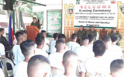 <p><strong>ROTC SUMMER CAMP.</strong> Lt. Col. Antonio Esmero, 701st Ready Reserve Battalion commander, delivers his inspirational message during the opening ceremony of the ROTC Summer Camp Training in Camp Lapu-Lapu, Cebu City, on Monday (April 29, 2019). Seated on stage are (left to right) Lt. Col. Rowel Gavilanes, 701st Community Defense Center (CDC) director; Col. Gerry Borja, 7th Regional Community Defense Group commander; and 7RCDG Adjutant Frederick Marquez.  <em>(Photo by John Rey Saavedra)</em></p>