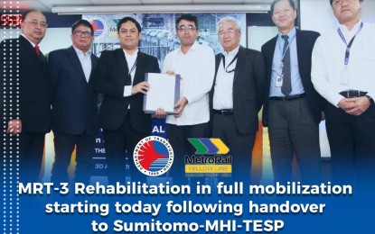 <p><strong>OFFICIAL TURNOVER OF MRT-3 REHAB.</strong>  Transportation Undersecretary for Railways Timothy John Batan (3rd from right), officially  turns over the documents to Sumitomo-MHI-TESP as the new rehabilitation and maintenance service provider for the MRT-3. <em>(Photo courtesy of DOTr)</em></p>