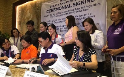 <p><strong>IRR FOR EXPANDED MATERNITY LEAVE LAW.</strong> Labor Secretary Silvestre Bello III (seated, second from right), together with Civil Service Commission Chairperson Alicia dela Rosa-Bala (second from left), and Social Security System president and CEO Aurora Ignacio (right), lead the signing of the Implementing Rules and Regulations (IRR) for the Expanded Maternity Leave Law during the Labor Day job and business fairs in the City of San Fernando, Pampanga on Wednesday (May 1, 2019). The signing of the IRR will pave the way for the full implementation of the Expanded Maternity Leave Law which was signed by President Rodrigo Duterte last February. <em>(Photo courtesy of  DOLE Region III)</em></p>