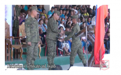 <p><strong>FROM REBEL TO CIVILIAN PROTECTOR.</strong> Army Private Albert diez, a former New People's Army (NPA) political instrutor, receives his certiicate after graduating from the Candidate Soldier Course on April 26 in Compostela Valley. <em><strong>(Photo courtesy of the 10th Infantry Division)</strong></em></p>