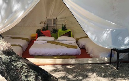 <p><strong>GLAMPING.</strong> A luxurious camp set up in Limasawa Island by Kamp Kolambu to curb the shortage of accomodations in the Southern Leyte Island. Unlike ordinary camping, glamping offers amenities such as comfortable beds, bathroom facilities, and food services. <em>(Photo courtesy of Kamp Kolambu)</em></p>