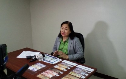 <p><strong>MUTILATED BILLS.</strong> Director Leonides Sumbi, of the Bangko Sentral ng Pilipinas Cebu Regional Office, shows samples of unfit bills and mutilated banknotes during a press conference in Cebu City on Wednesday (May 8, 2019). Sumbi warned the public on the proliferation of mutilated bills during the election period. <em>(Photo by Luel Galarpe)</em></p>