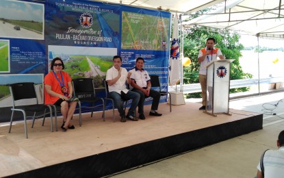 <p><strong>ALTERNATE ROAD IN BULACAN. </strong>Public Works and Highways Secretary Mark Villar (right) delivers his short message during the inauguration of the 9.6-kilometer Pulilan-Baliuag Diversion Road in Pulilan, Bulacan on Thursday, May 9, 2019. Looking on are Pulilan Mayor Maritz Ochoa-Montejo, Rep. Gavini Pancho and DPWH Regional Director Roseller Tolentino. <em>(Photo by Manny Balbin)</em></p>