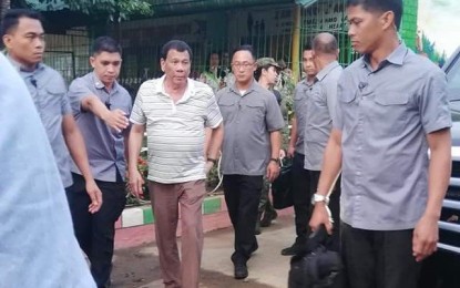 <p><strong>SECURITY MEETING.</strong> President Rodrigo R. Duterte arrives in Moises Padilla, Negros Occidental on Wednesday afternoon for a security meeting with Interior Secretary Eduardo Año and Defense Secretary Delfin Lorenza, and top officials of the Philippine National Police and the Philippine Army in Western Visayas. The conference, held at Moises Padilla Elementary School, took place two days after Commission on Elections (Comelec) put Moises Padilla under its control. <em>(Photo courtesy of Divine Gane)</em></p>