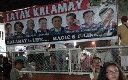 <p><strong>‘MAGIC 8’.</strong> A tarpaulin of the eight senatorial candidates supported by 'Tatak Kalamay' is displayed at the plaza of La Carlota City, Negros Occidental. Sugar stakeholders hope these candidates will be the industry’s champions in the Senate.<em> (Photo from 'Tatak Kalamay' Facebook page)</em></p>
<p><em> </em></p>